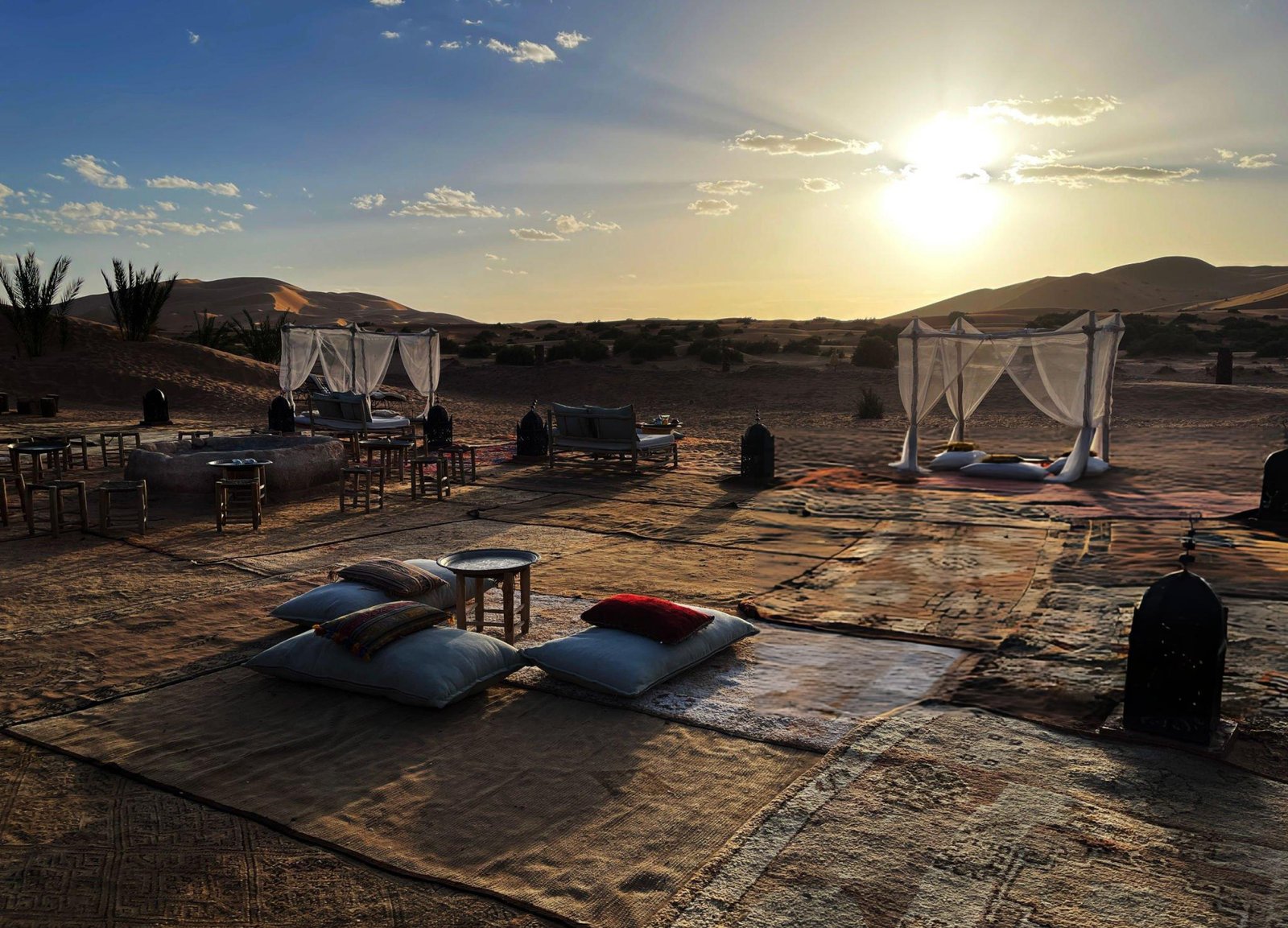 Luxury desert camp Morocco sunset